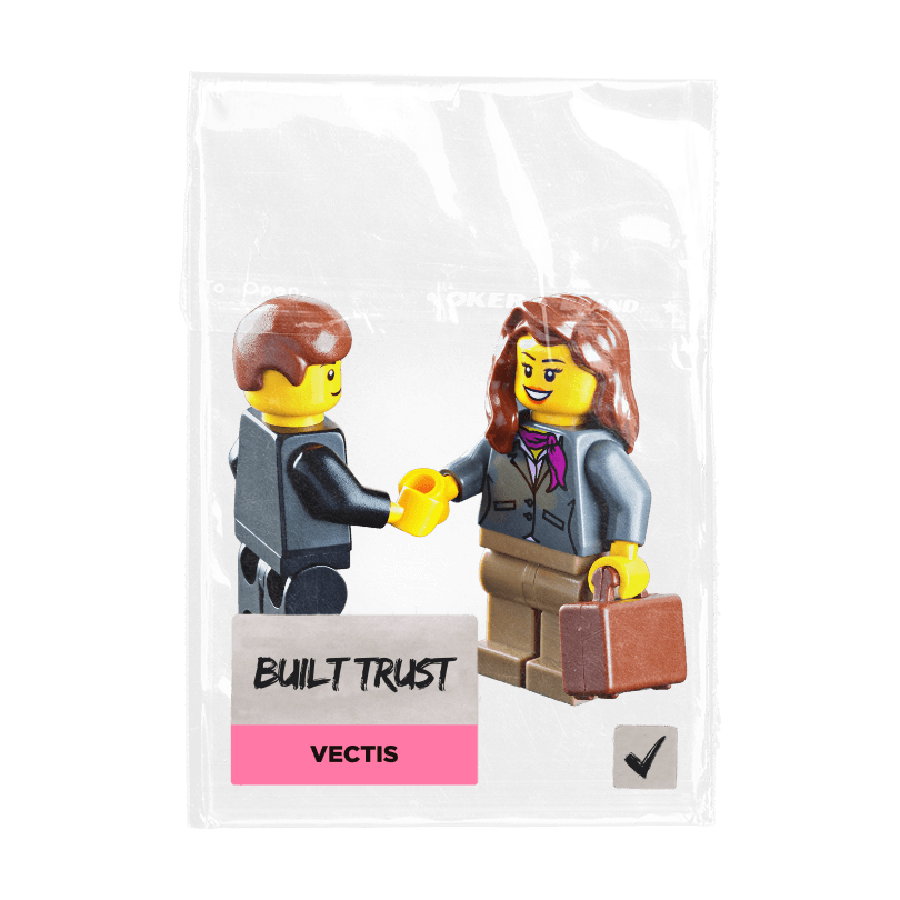 a lego business colleague shaking hands on a small bag with a sticker and the words built trust meaning consulting