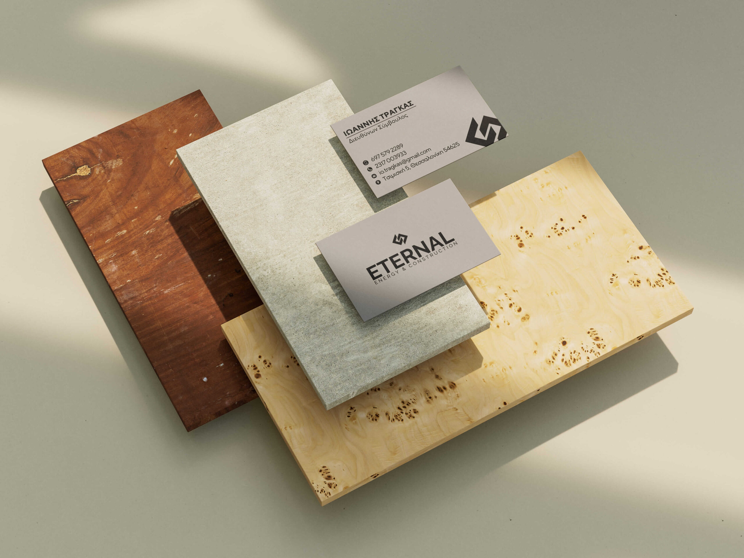 presentation of corporate cards eternal grey black color on a background of stone and wood.