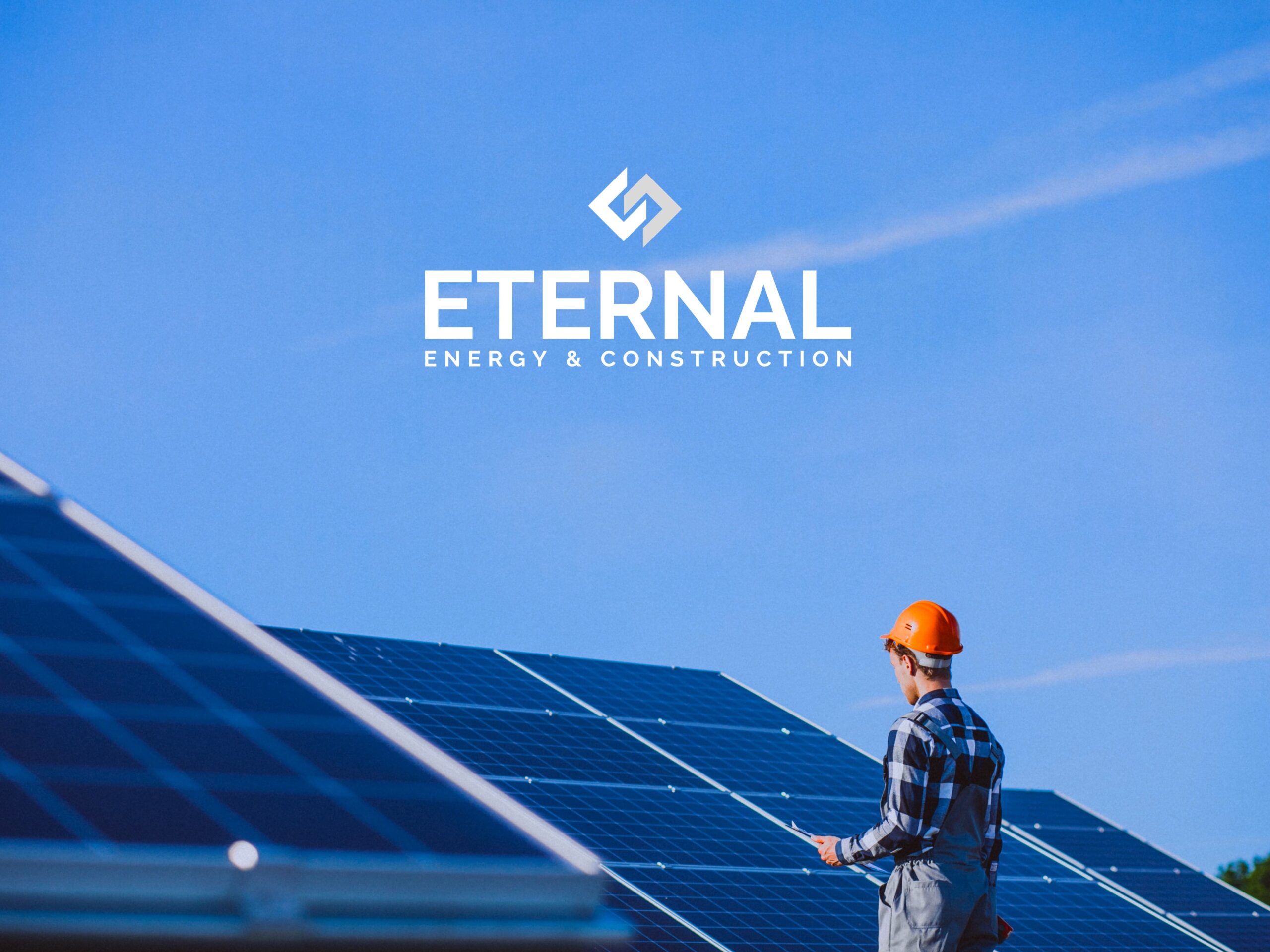 Man wokring in enery system panel and the logo of Eternal company.